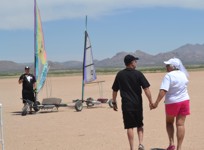 The newlyweds walking out
                  to the tandem landsailer